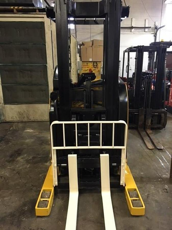 Front view of Yale NR040DANS24TE091 reach truck showing forks, three‑stage mast, and CSA certification decal during Brampton deployment