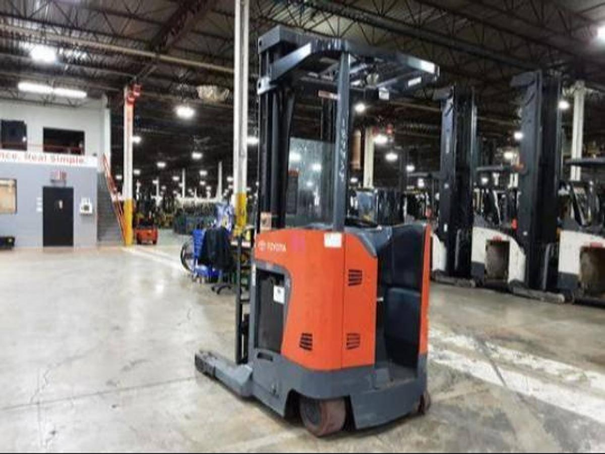 Rear side angle view of Toyota 8BRU23 electric reach truck – CSA-certified 4,500 lb freezer-rated unit with ergonomic operator station, poly tires, and reconditioned chassis – Premier Lift Equipment Brampton ON
