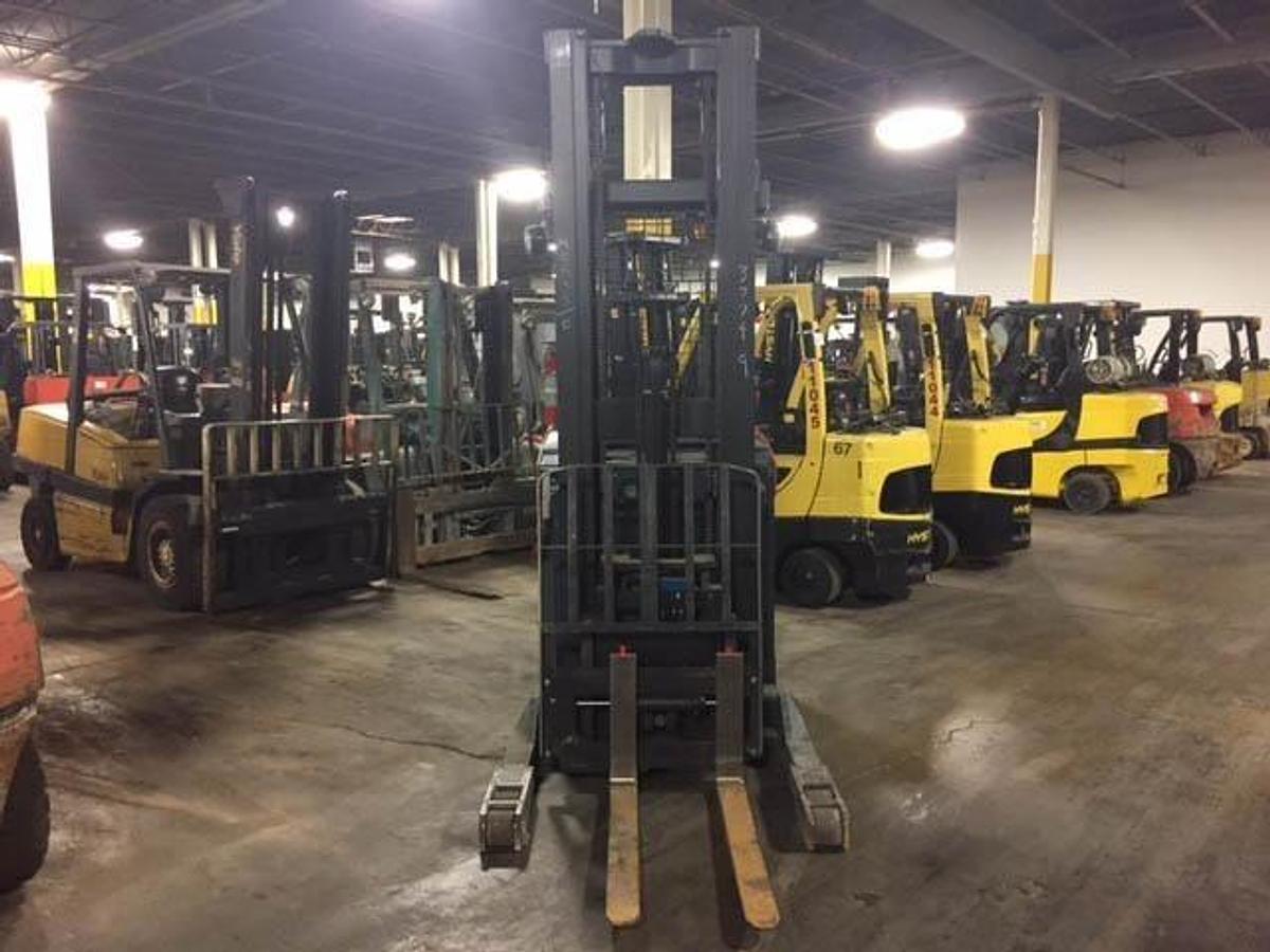 Frontal view of 2014 Toyota 8BRU23 electric reach forklift showing 114/258” triple-stage mast and carriage assembly