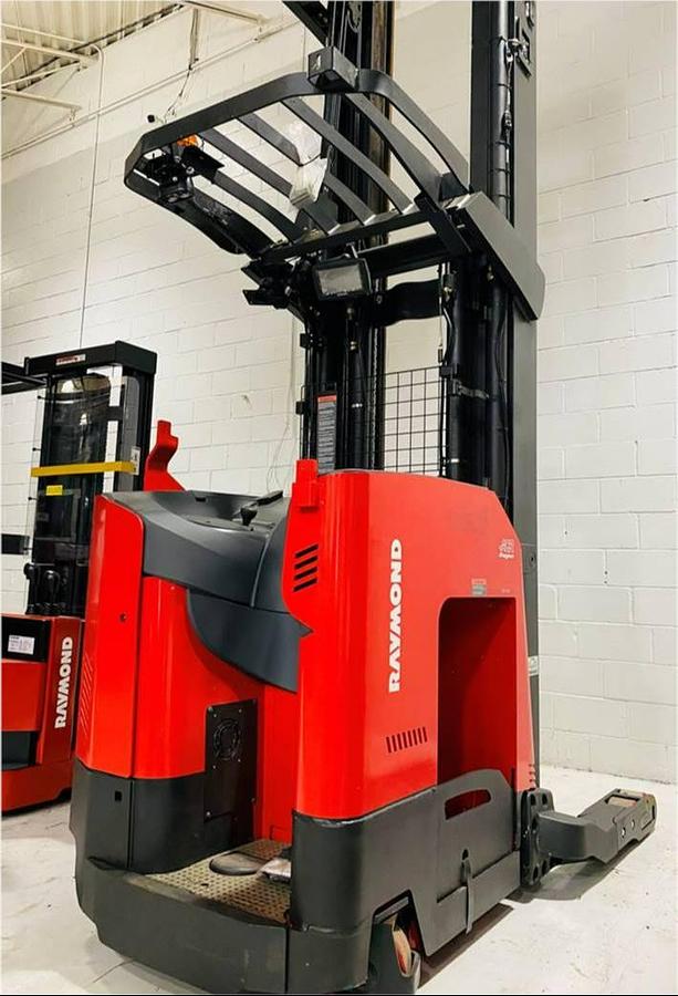 Rear side angle of Raymond 752DR32TT deep-reach forklift showing counterweight, rear wheels, and CSA certification during warehouse deployment