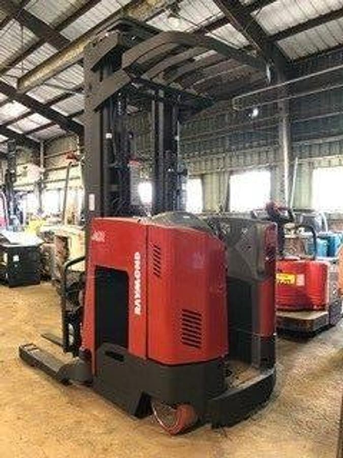 Rear side angle of Raymond 740DR32TT deep-reach forklift showing counterweight, rear wheels, and CSA certification during warehouse deployment