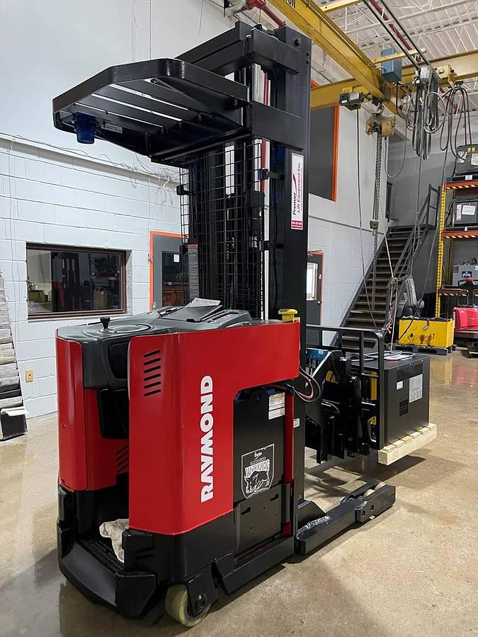 Refurbished 1999 Raymond EASIR30TT electric reach truck with CSA certification and new paint deployed in Mississauga for narrow aisle warehouse operations