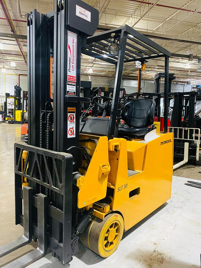Front angled view of Drexel SLT30 electric swing mast forklift showing mast rails, fork tips, and CSA-certified chassis – unit staged in Brampton ON