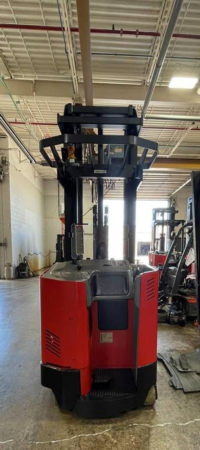 Rear side angle of Raymond EASI-DR25TT deep-reach forklift showing counterweight, rear wheels, and CSA certification during warehouse deployment