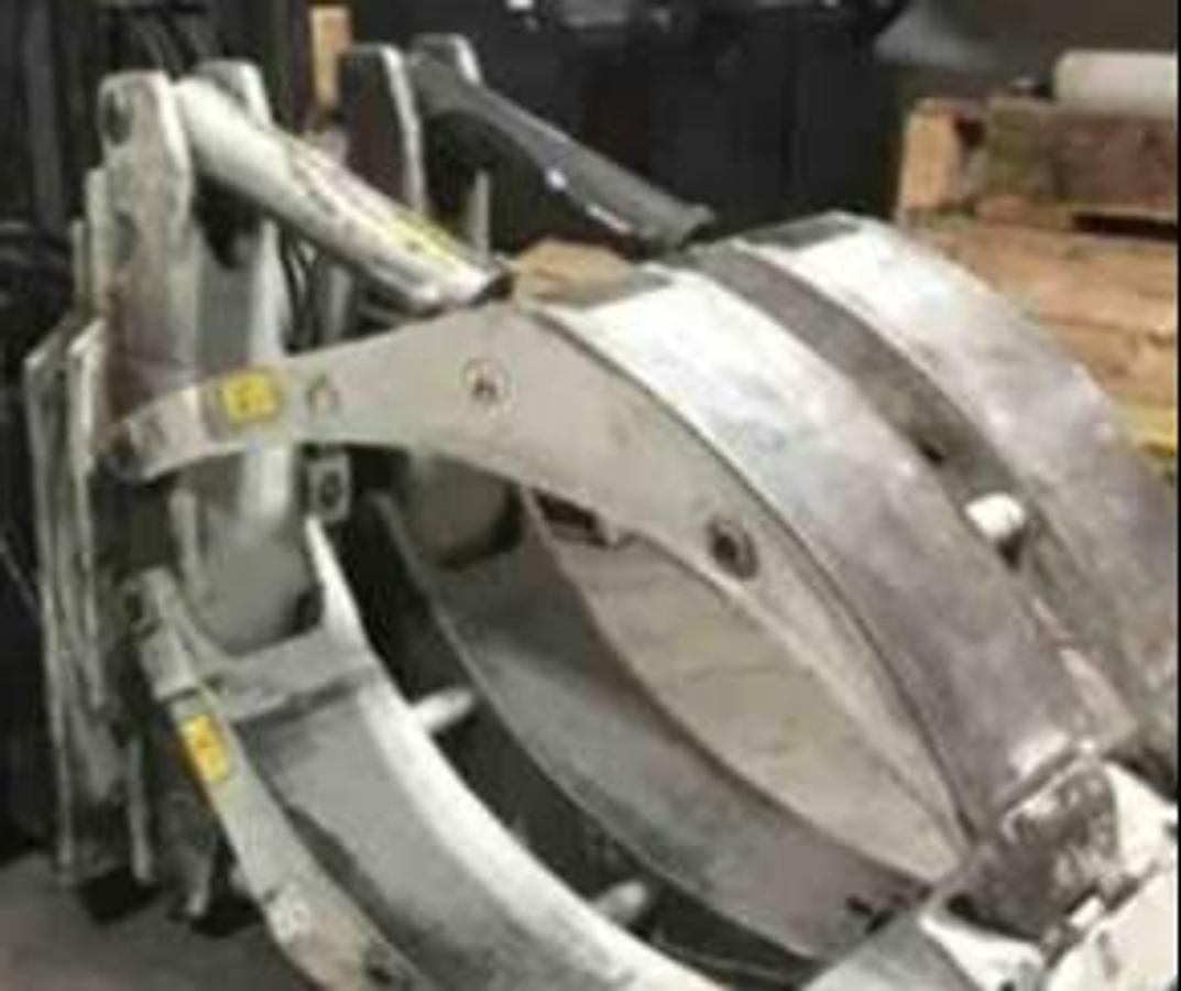 Close-up of Cascade paper roll clamp mounted on refurbished 2014 Hyster S120FTPRS LPG cushion forklift, showing hydraulic arms configured for 72" diameter rolls during Brampton deployment