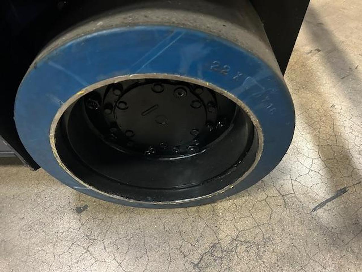 Poly drive tire on Toyota 7FBCU35 showing tread pattern and electric cushion chassis.