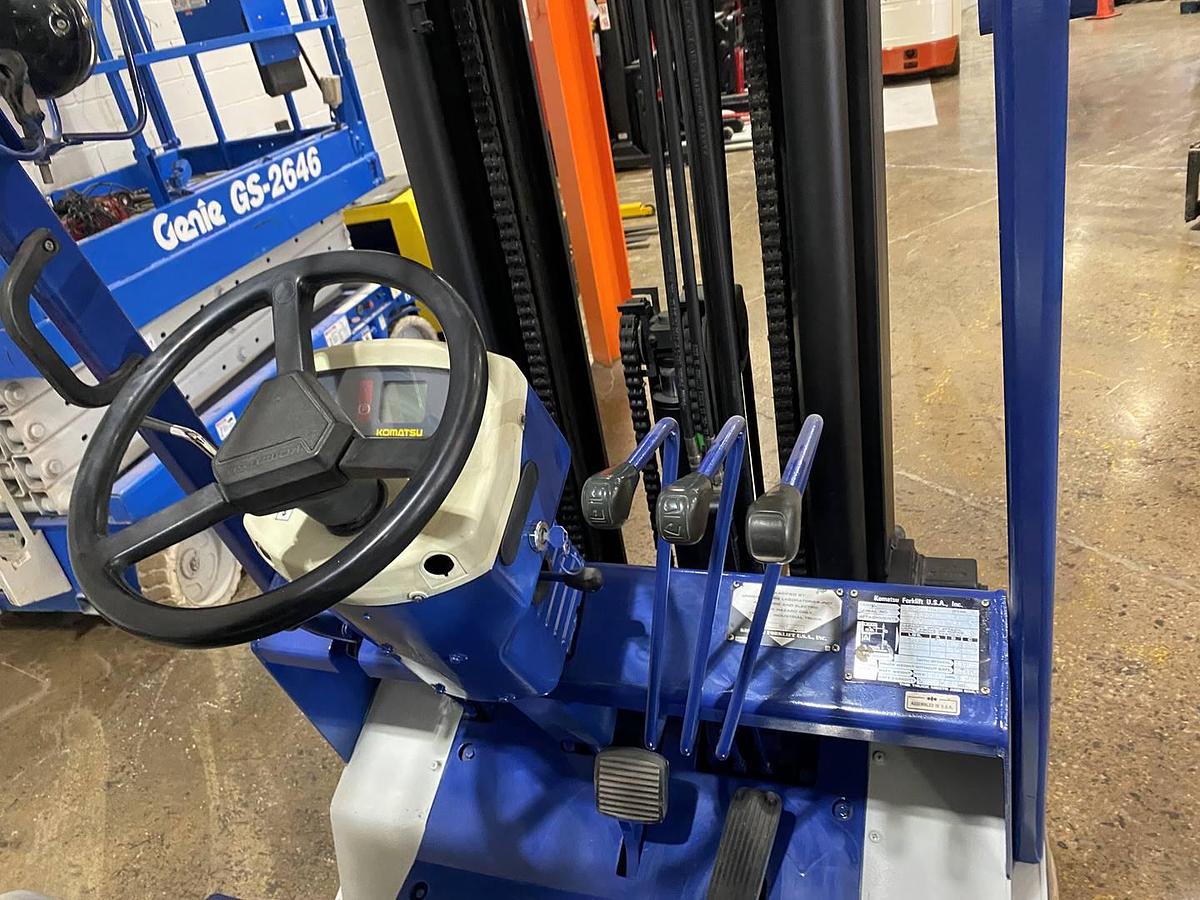 Operator seat view showing dashboard, controls, and CSA labeling