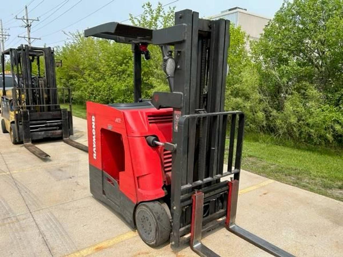 Side view of refurbished 2012 Raymond 445-C30TT electric docker showing battery compartment, chassis frame, and triple mast during Toronto deployment
