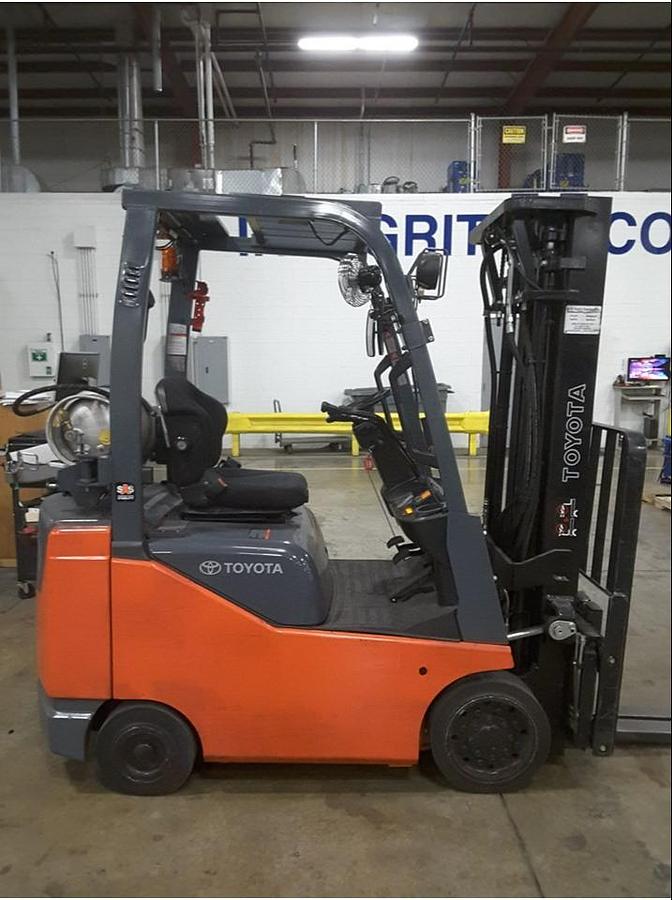 side view of refurbished 2014 Toyota 8FGCU18 LP gas forklift showing operator cab, rear chassis, and CSA decal during Brampton deployment