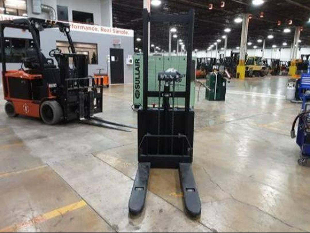 Front view of refurbished 2019 Vestil S‑62‑FF forkoover stacker showing 27"x 42" forks, 30" wide frame, 66" back‑to‑tip reach, 62" lift height, 2‑stage mast, and CSA/MOL certification decal during Brampton deployment.