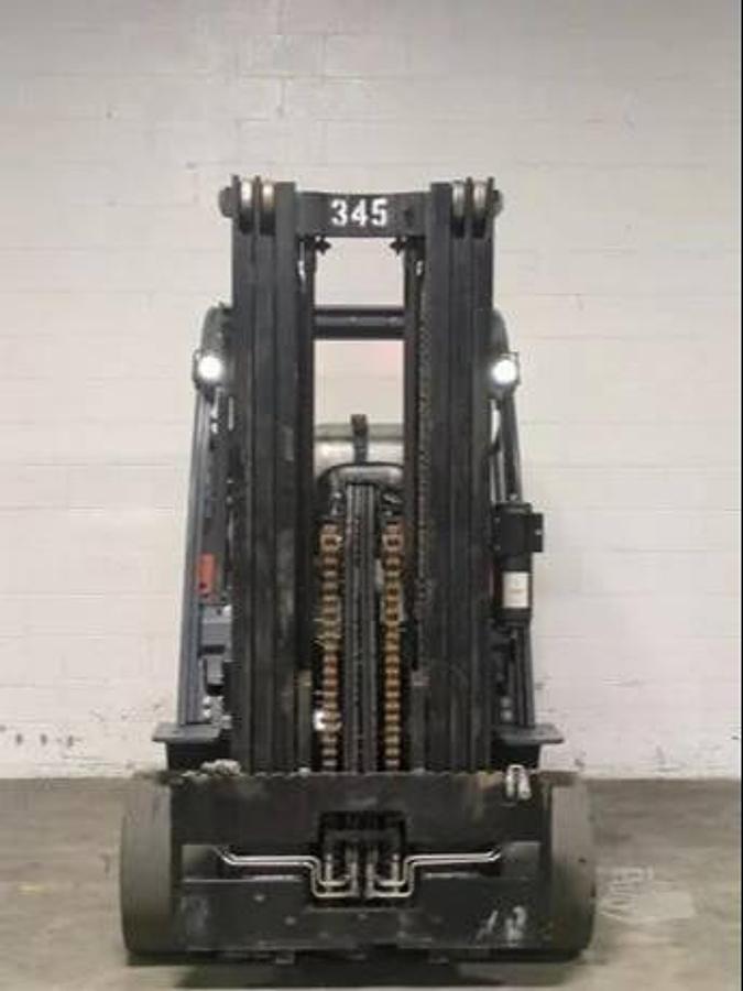 Front view of 2019 Toyota 8FGC45U-BCS forklift showing triple-stage mast, 45” forks, side shift carriage, and CSA-certified overhead guard – unit staged in Brampton ON