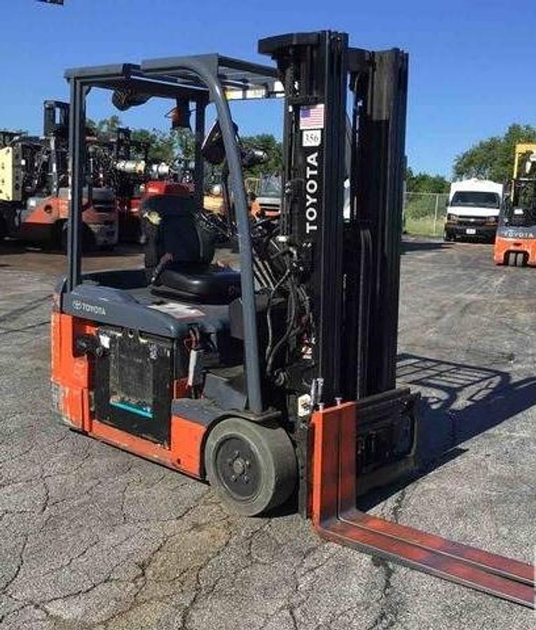 Rear view of 2019 Toyota 8FBE15U electric forklift showing battery compartment, compact 3-wheel chassis, and triple mast during Mississauga deployment