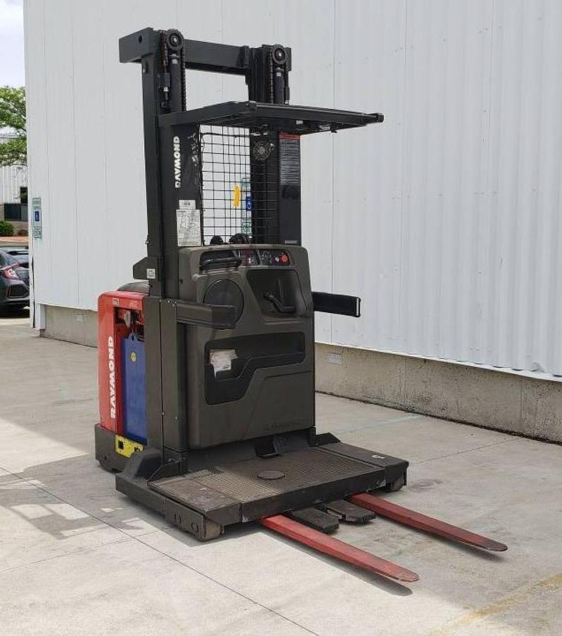 Front angle view of refurbished 2013 Raymond 550-OPC30TT electric order picker showing mast, forks, platform, and CSA inspection tag during Mississauga deployment