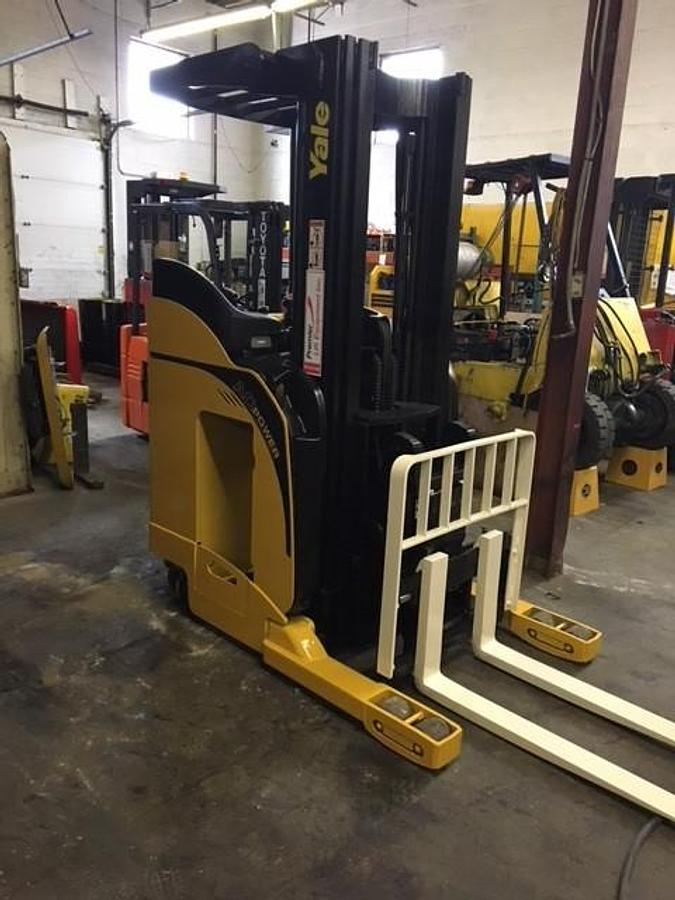 Front side view of Yale NR040DANS24TE091 reach truck showing chassis, mast structure, and CSA certification decal during Brampton deployment