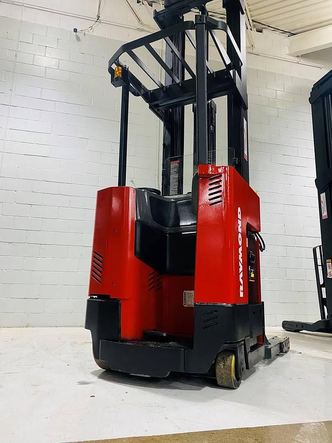 Alt="Back view of SOLD 2000 Raymond EASIR40TT CSA reach truck showing counterweight and electric chassis preserved as legacy artifact"