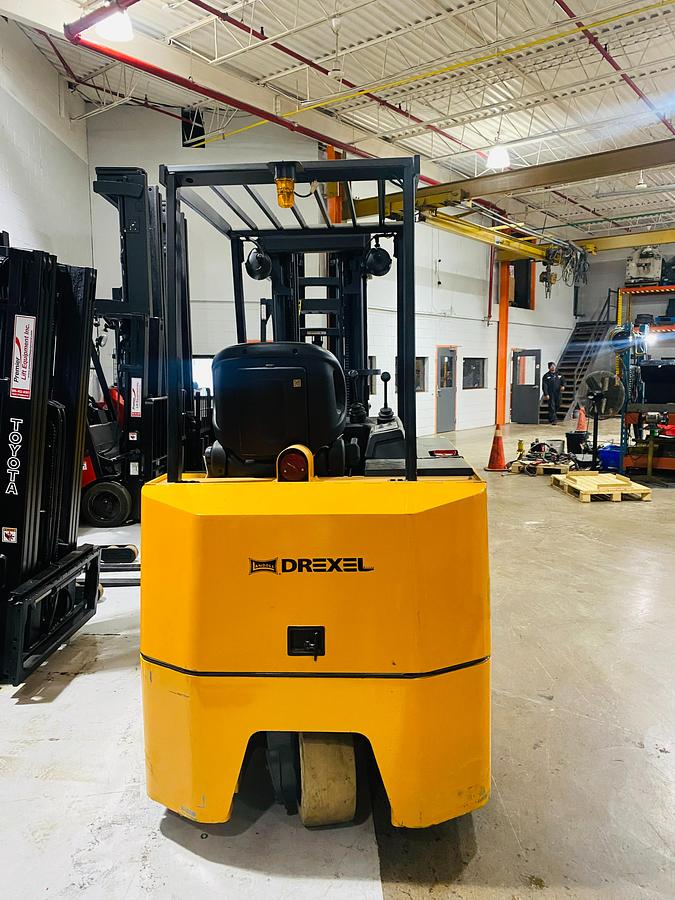 Rear view of Drexel SLT30 electric swing mast forklift showing counterweight, battery compartment, and CSA-certified frame – unit staged in Brampton ON