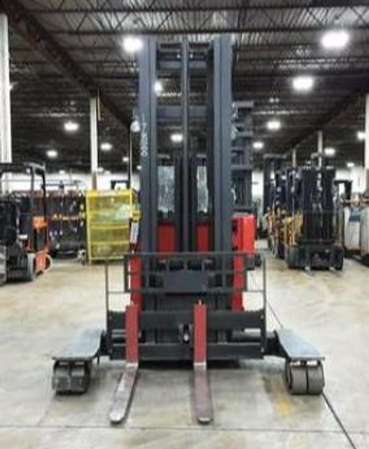 Head-on view of Raymond EASI 4DR-45TT electric reach truck showing base legs, mast rails, forks, and operator cab with CSA safety decals visible during Brampton deployment