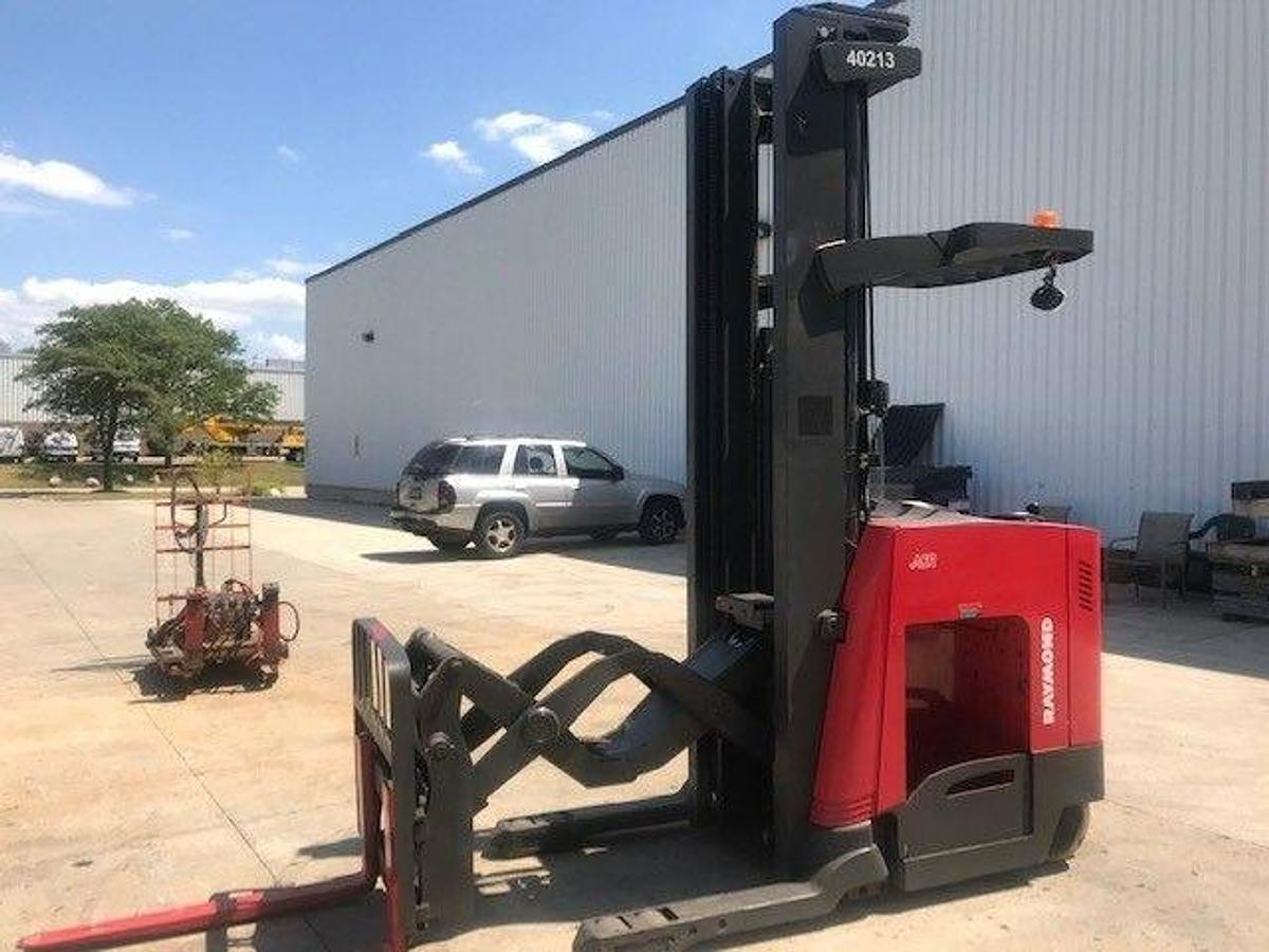 Front side angle of Raymond 750DR32TT deep-reach forklift showing 321" triple mast, reach carriage, directional wheels, and narrow aisle chassis during Brampton deployment