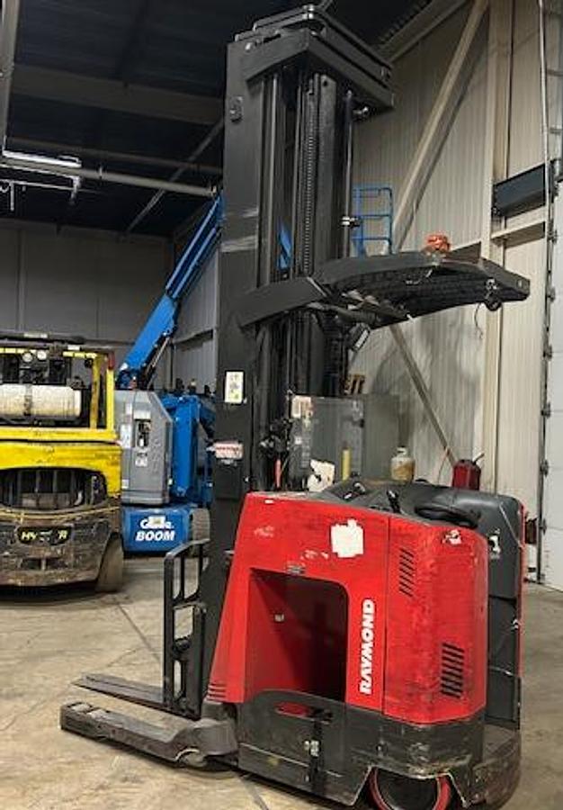 ORear view of Raymond 750‑DR32TT showing counterweight and mounted safety lighting