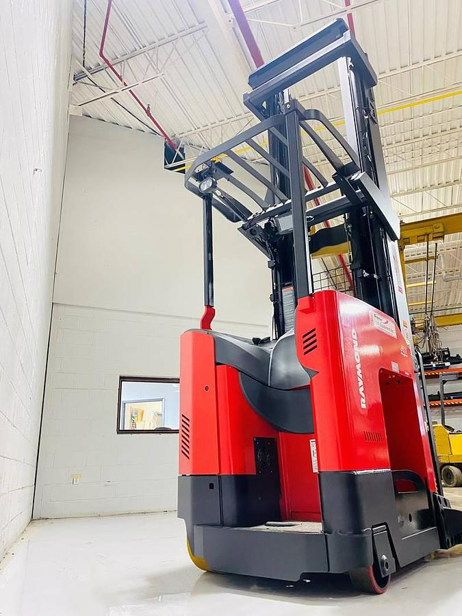 Rear angle view of 2022 Raymond 752-R45TT freezer reach truck showing chassis-only build with open battery compartment, rear caster wheel, and poly drive tire – CSA certified unit staged in Brampton ON