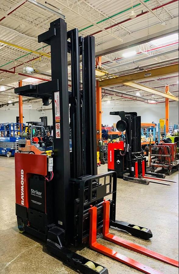 “Front view of Raymond EASIR40TT Budget reach truck — mast, carriage, and poly tires