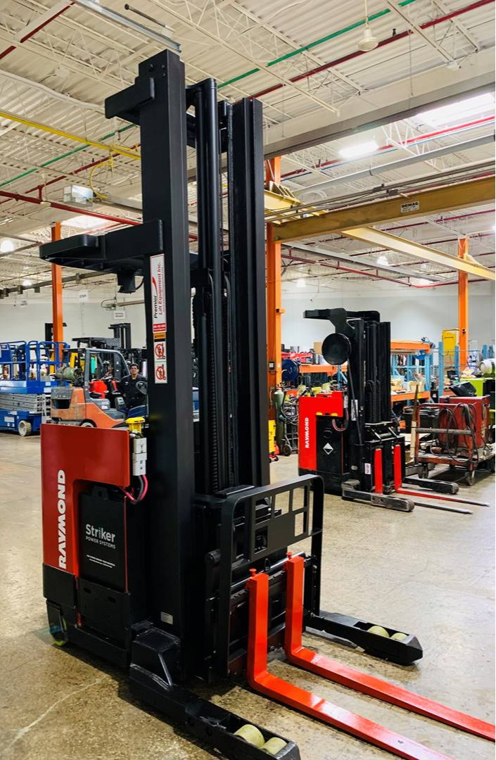 “Front view of Raymond EASIR40TT Budget reach truck — mast, carriage, and poly tires