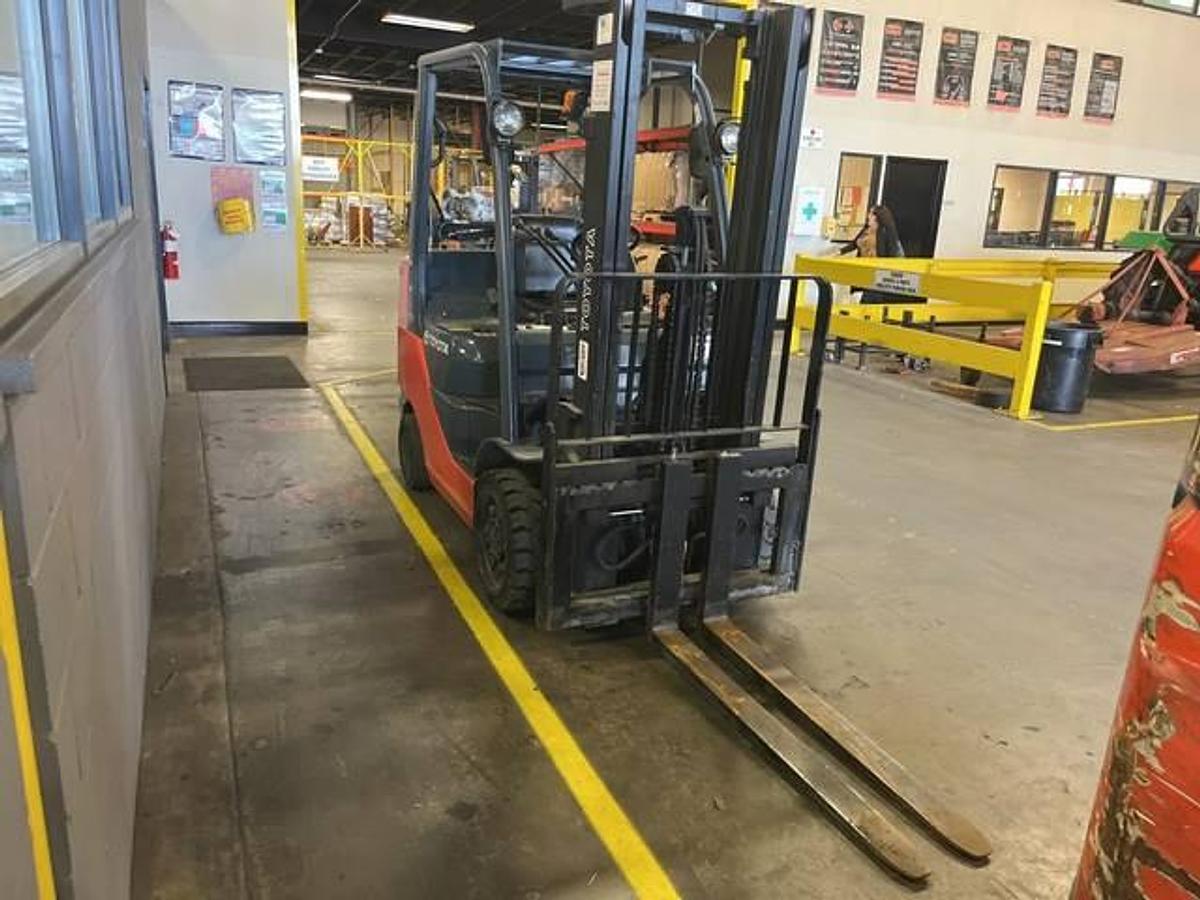 Opposite side view of refurbished 2018 Toyota 8FGCU30 LP gas forklift showing operator cab, rear chassis, and CSA decal during Brampton deployment