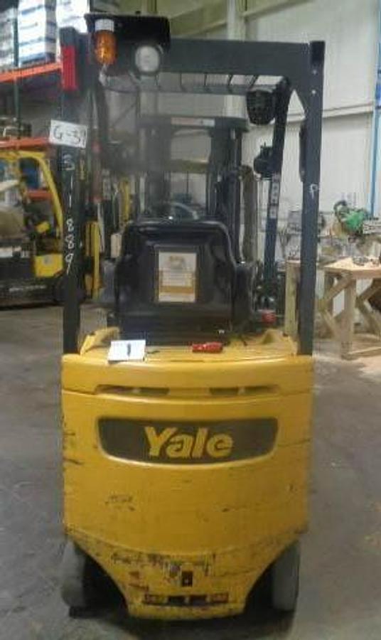 Back view of refurbished 2011 Yale ERC030VAN electric forklift showing counterweight, battery compartment, and CSA inspection tag during Brampton deployment