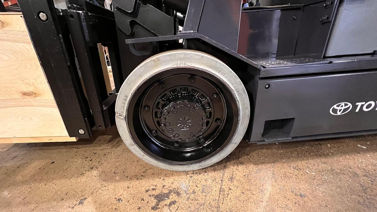 Right cushion drive tire showing smooth tread pattern and CSA indoor spec