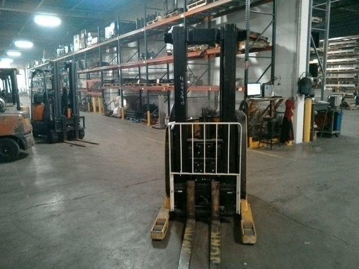 Front view of refurbished 2012 Yale NR040EA electric reach truck showing fork carriage, mast extension, and side shift mechanism during Ontario deployment
