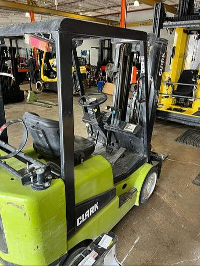 “Rear angle view of Budget Clark CGC25 older LPG cushion forklift, non‑CSA, suitable for light‑duty indoor/outdoor shop work.