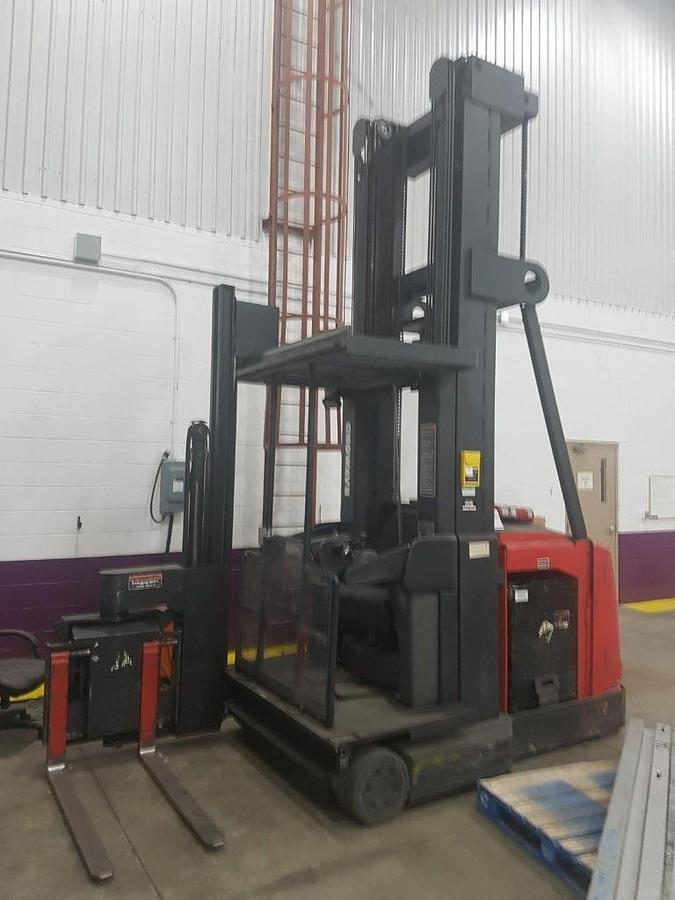 Side view of refurbished 2006 Raymond electric man-up turret truck showing swing reach mast, CSA decal, and 62.5" wide platform during Ontario deployment