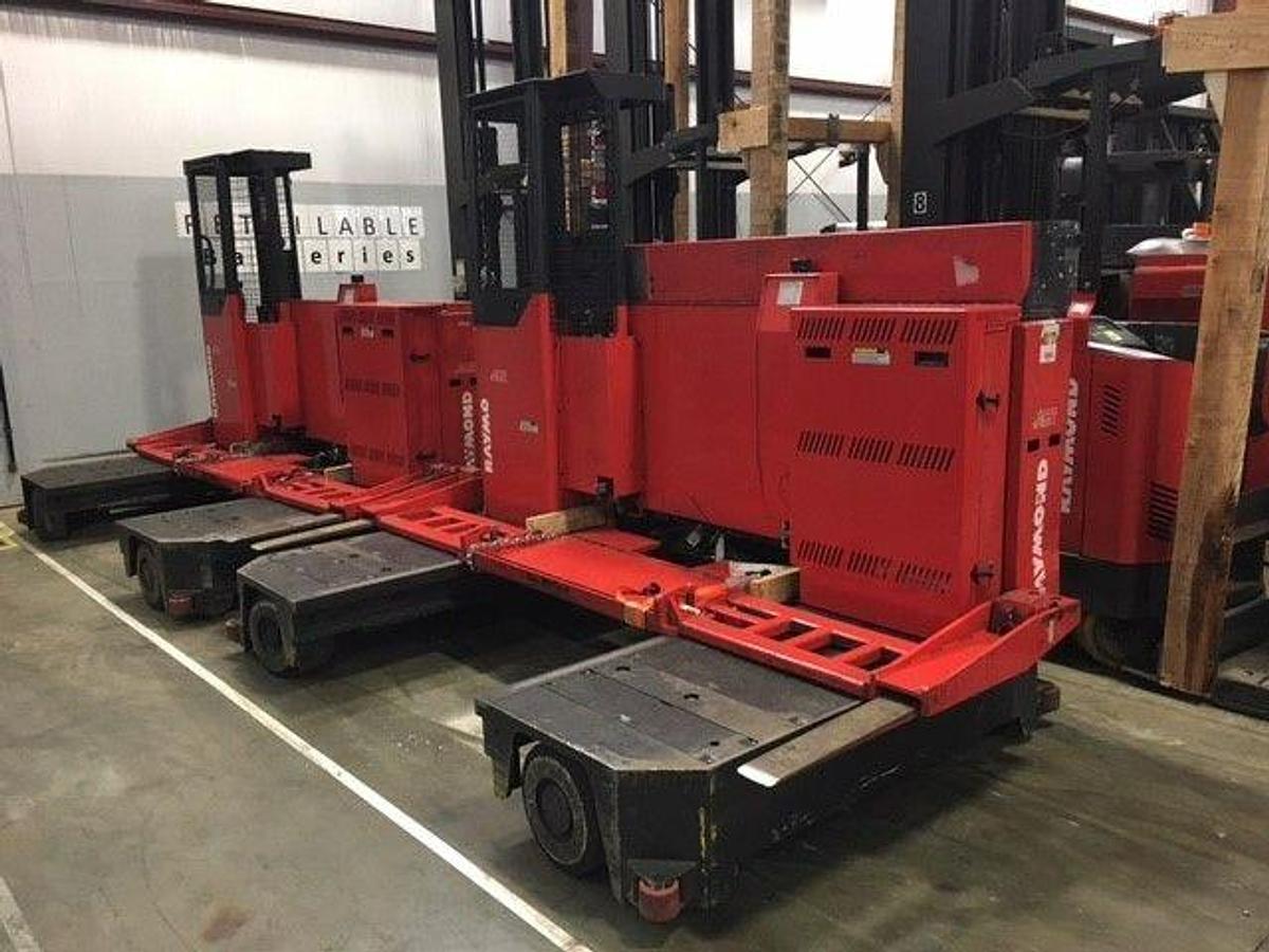 Refurbished 2012 Raymond 9300-SL60TN electric sideloader with 48" bed and CSA decals shown at front side angle during Brampton deployment