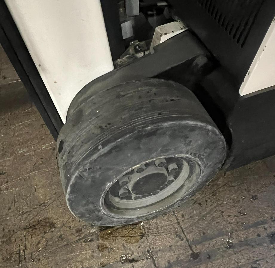 Right front tire of Budget Crown 35RCTT‑190 Dockstocker, indoor poly cushion tire on older non‑CSA unit.