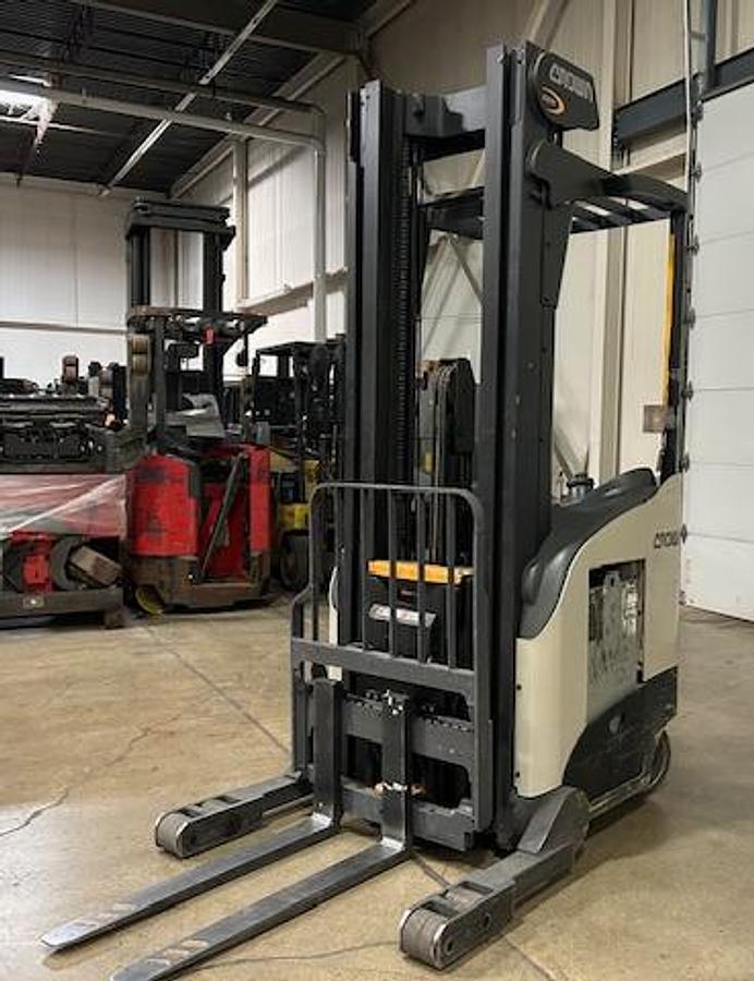 2016 Crown RR5795S‑45 reach truck – opposite front angle showing forks and mast assembly