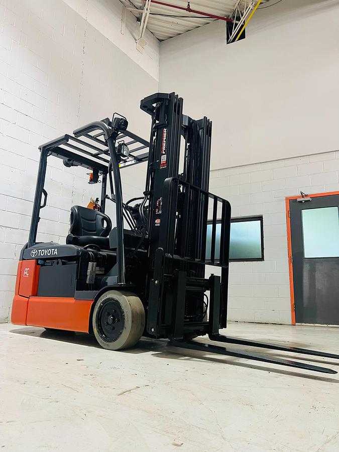 Front Side Angle View Used 2016 Toyota 8FBE20U electric forklift with quad mast and CSA decals shown at front side angle during Brampton deployment
