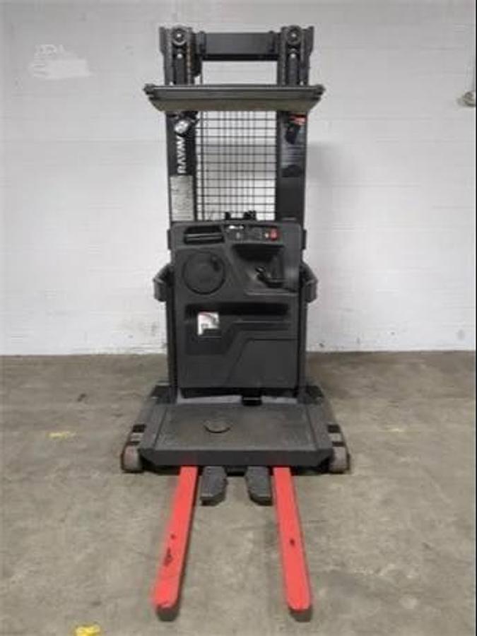 Front view of refurbished 2014 Raymond 560-OPC30TT electric order picker showing mast, platform, and chassis during Vaughan deployment