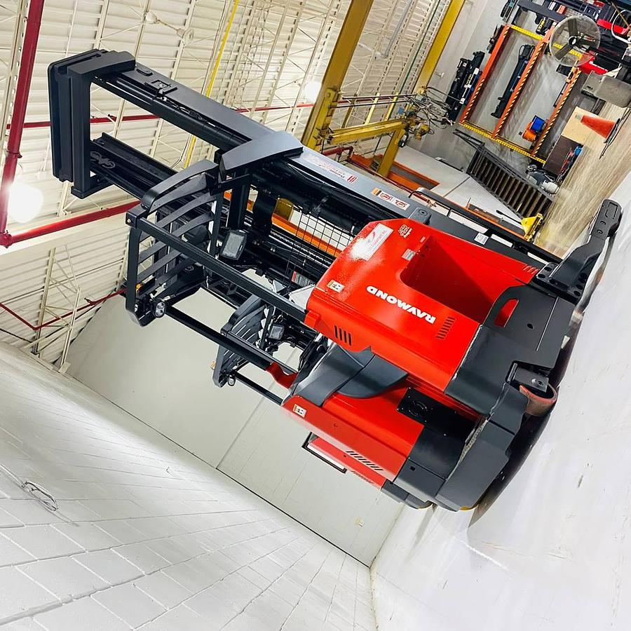 Angled view of two 2022 Raymond 752-R45TT freezer reach trucks showing triple-stage masts, load backrests, and 42” forks – CSA certified units in Brampton ON