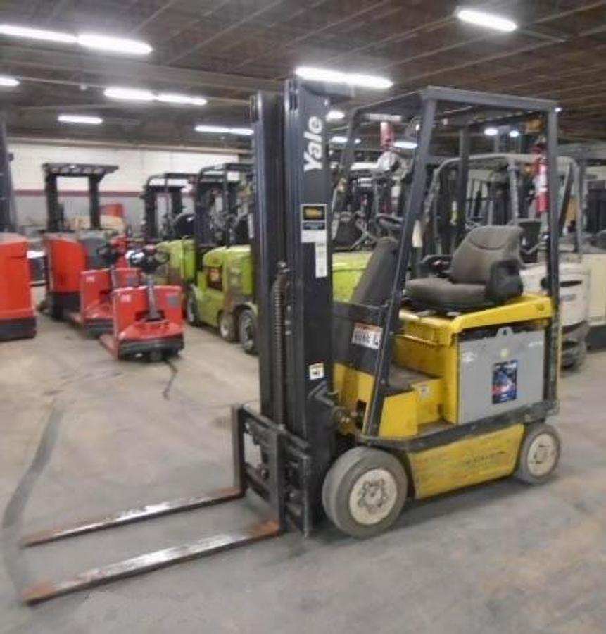 Side view of refurbished 2011 Yale ERC030VAN electric forklift showing operator cab, chassis, and triple mast during Brampton deployment
