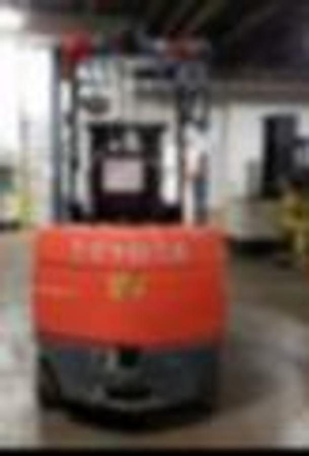 Rear view of Toyota 7FBCU35 electric forklift showing counterweight, battery compartment, and CSA certification decal during Brampton deployment