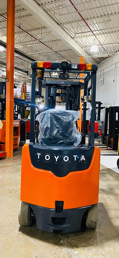 Back view of 2019 Toyota 8FBCU20 electric forklift – CSA-certified 4,000 lb compact chassis with rear counterweight, overhead guard, and cushion tires shown reconditioned with used battery option and new 48V battery upgrade available in Brampton ON – Premier Lift Equipment