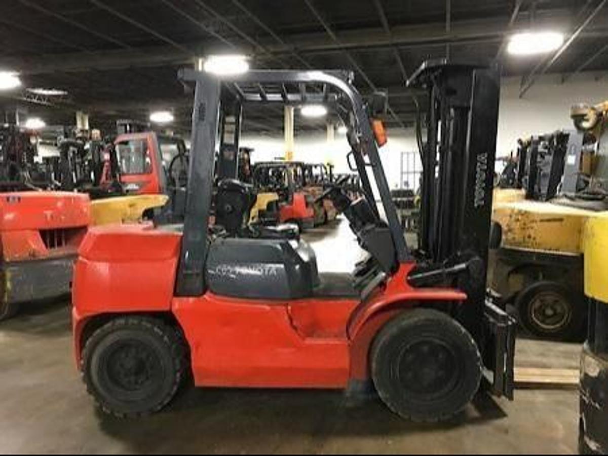 Side view of refurbished 2008 Toyota 7FGU35 LP gas forklift showing operator cab, chassis, and triple mast during Brampton deployment