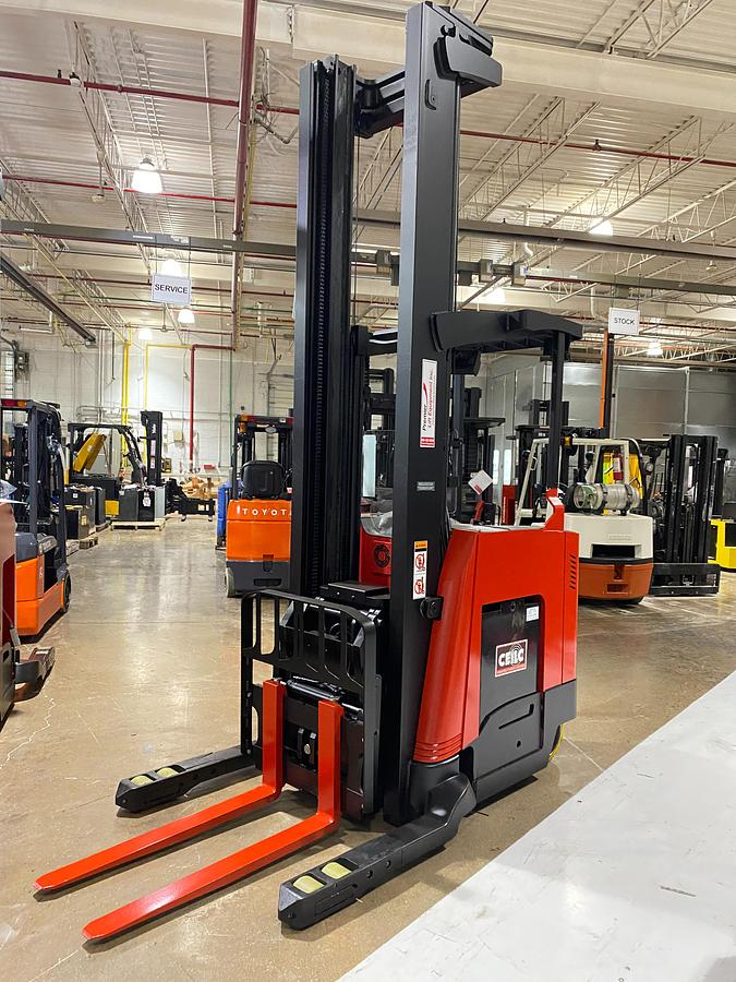 Front angle view of 2022 Raymond 752-DR32TT deep reach forklift showing triple-stage mast, 42” forks, 48” load backrest, and CSA-certified chassis – unit staged in Brampton ON