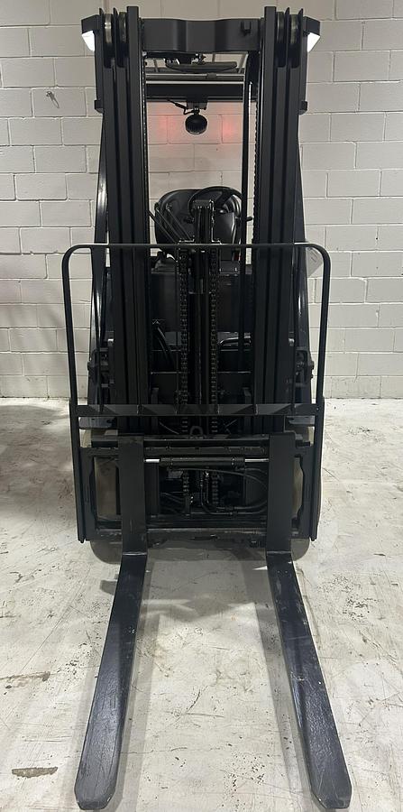 Toyota 8FBCU25 forklift front view with side-shift and forks CSA safety certified industrial equipment.