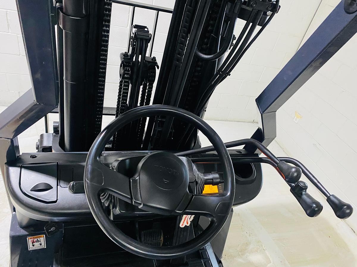 Operator seat view showing dashboard, controls, and CSA labeling