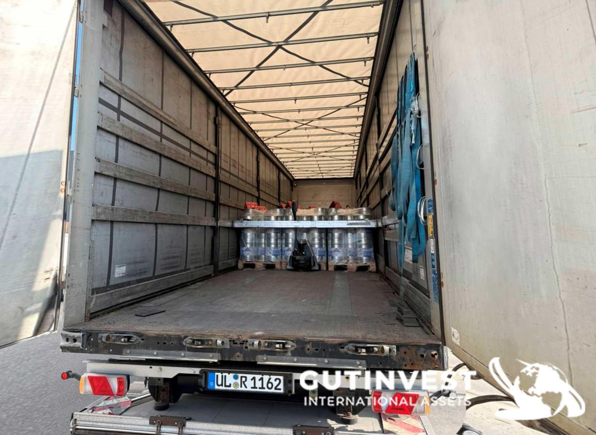 Used Truck with tarpaulin trailer and lifting platform