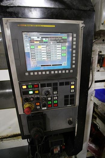 Used FUJI ANS-320TTS TWIN TURRET CNC LATHE WITH ROBOT LOAD/UNLOAD AND STOCKER TABLES