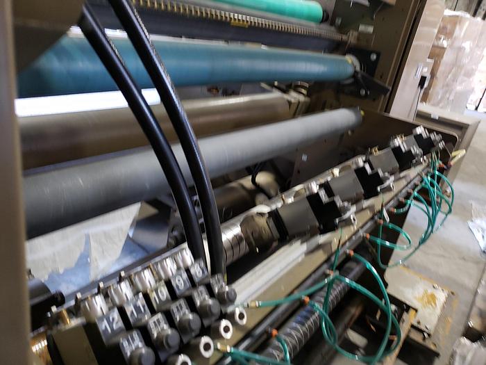 Used 56" WIDE PCMC TURRET REWIND WITH SLITTING