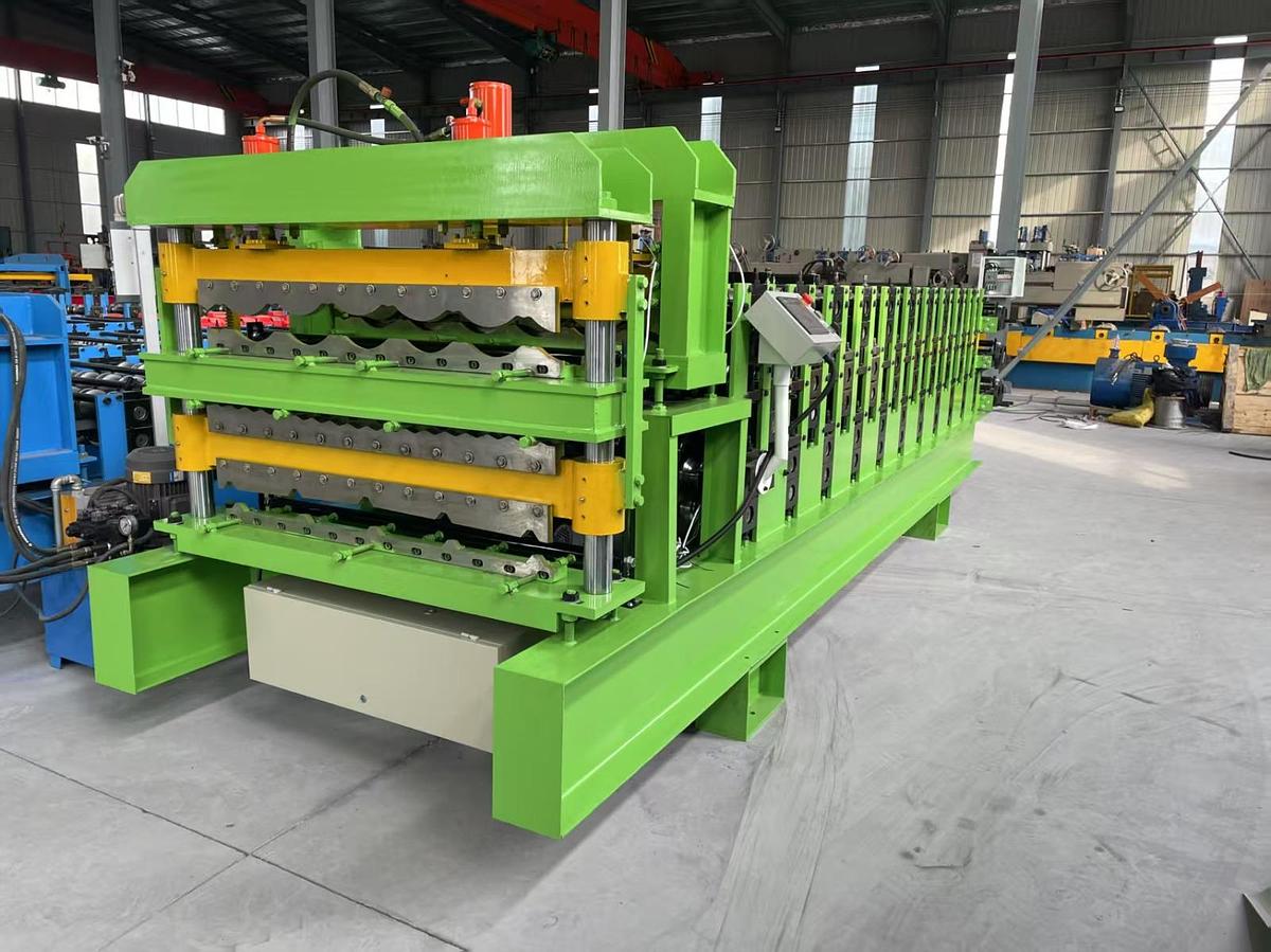 Machine for forming metal roof or wall panels