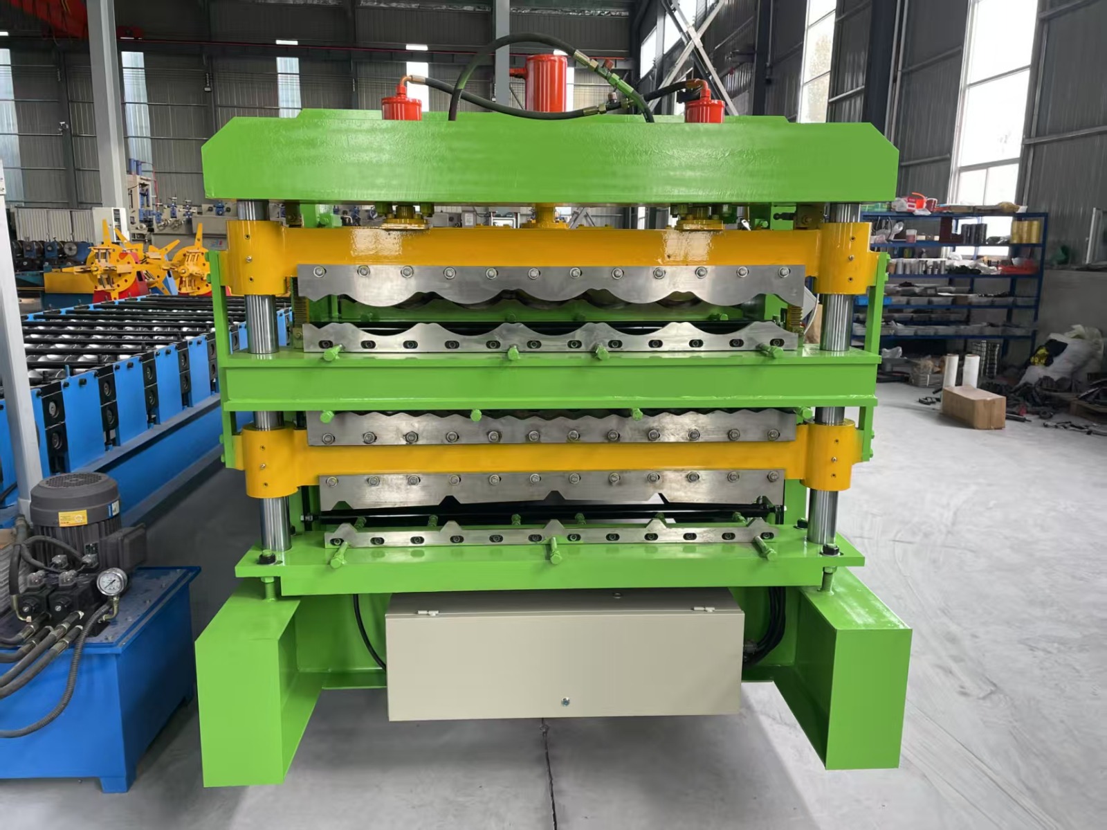 Machine for forming metal roof or wall panels